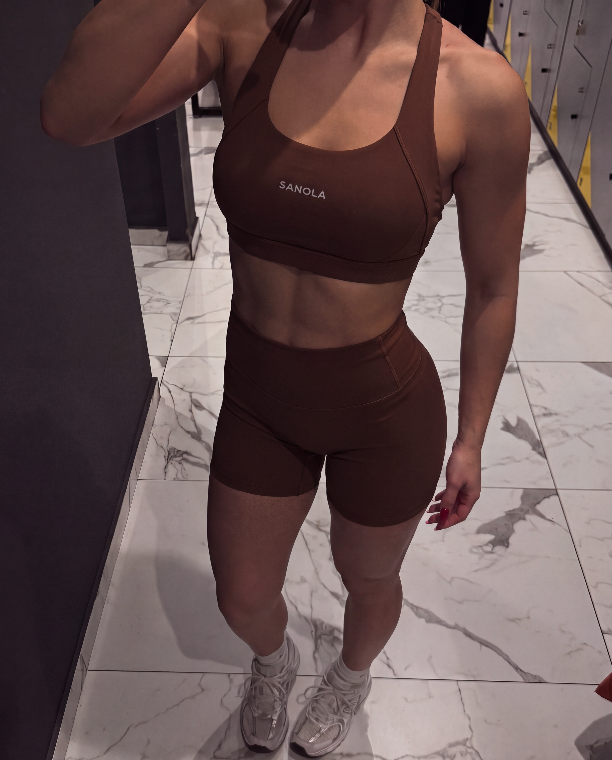 Sanola Refine Elina cross back sports bra in chocolate and Sanola Refine high waist shorts in chocolate