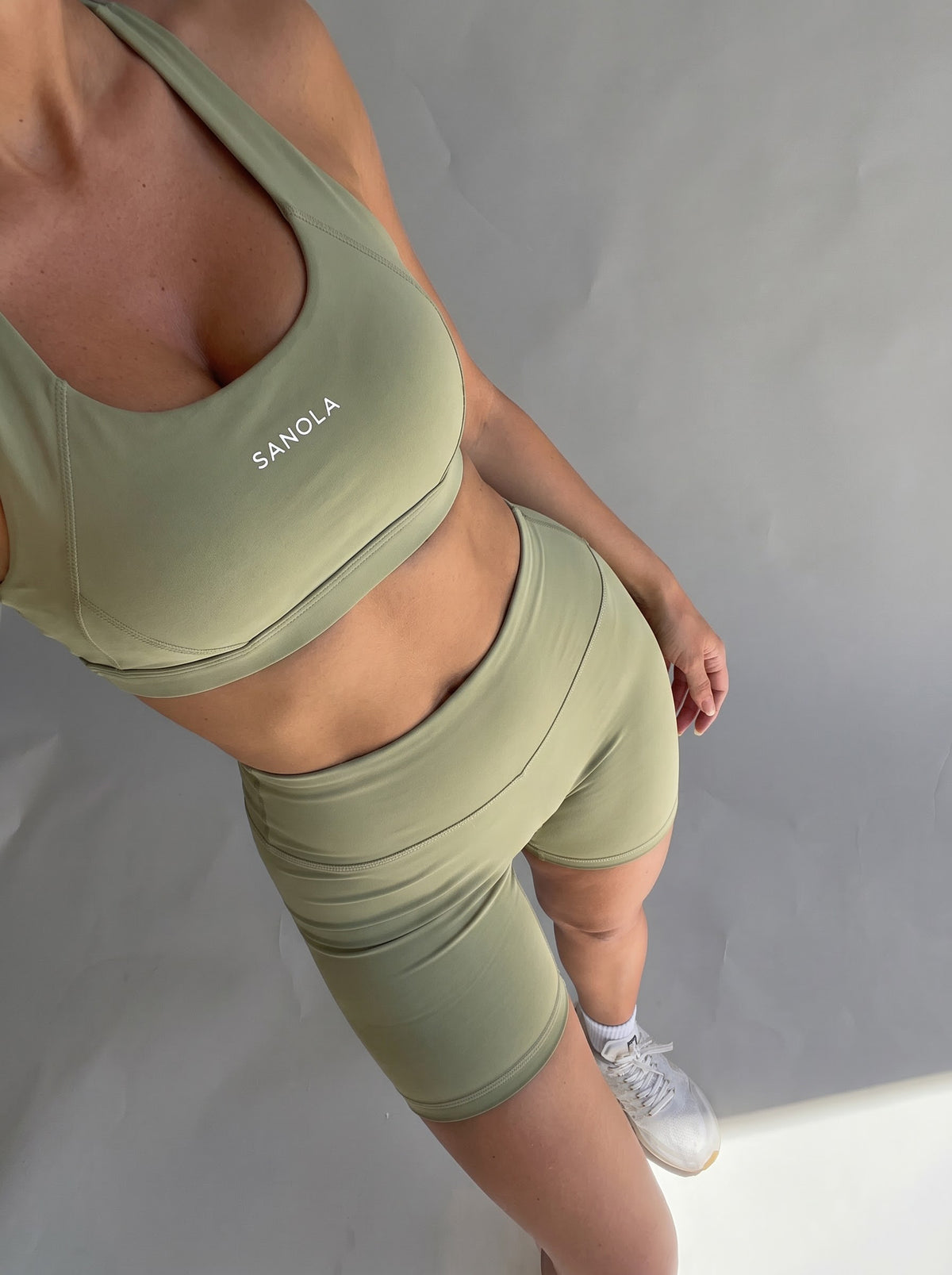 Sanola Refine Elina cross back sports bra in sage and Sanola Refine high waist shorts in sage